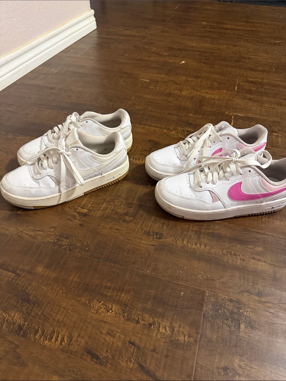 Nike  White Sneakers with Pink Swoosh Accent